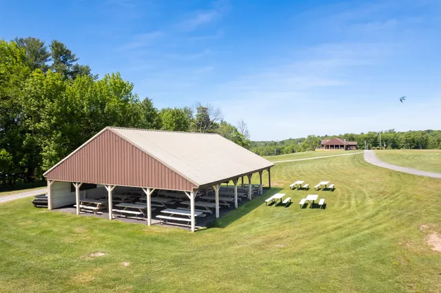 Covered outdoor pavilion with picnic tables for events