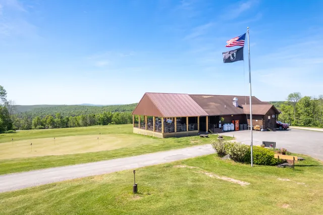 Flag, clubhouse and Catskill mountain views