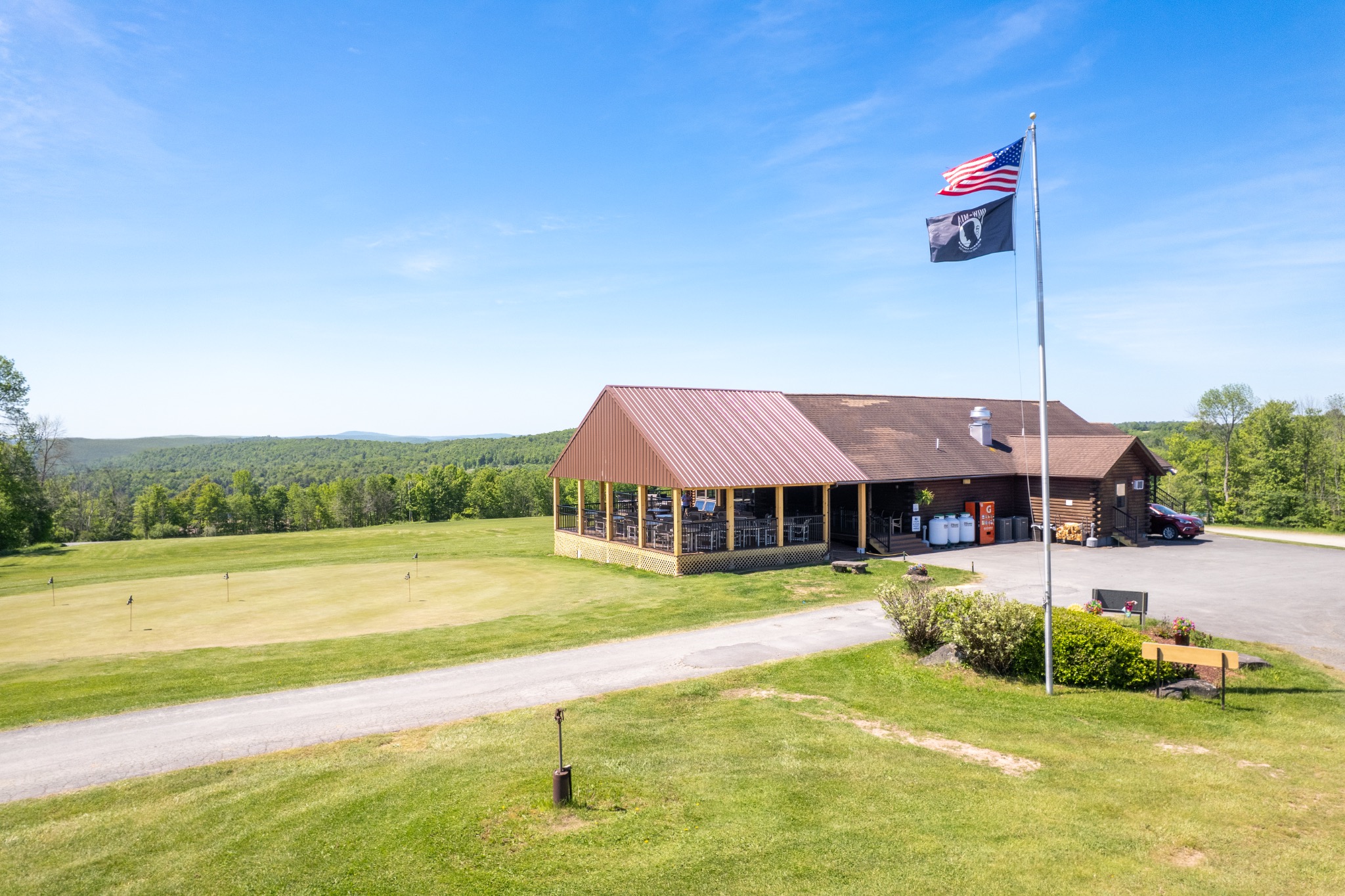 French Woods clubhouse, flag, putting green and Catskill mountain views